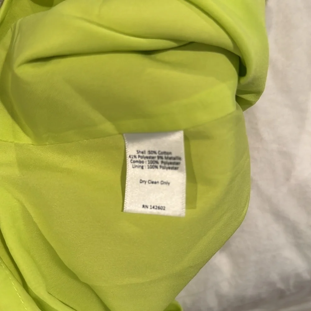 Sail to Sable green dress with silver white and black trim around neck
